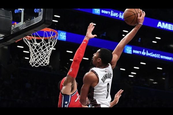 2 people playing basket ball