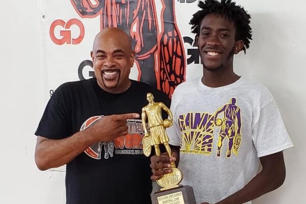 Eric Hicks holding trophy