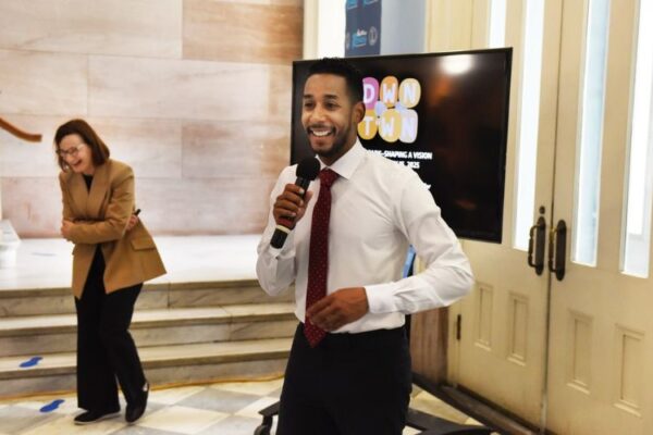 antonio reynoso is holding microphone