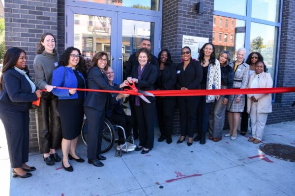 11 women is cutting ribbon for office inaugration